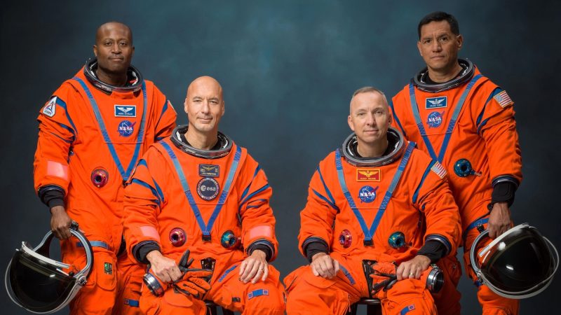 photo of four Artemis III astronauts posing for an official NASA portrait