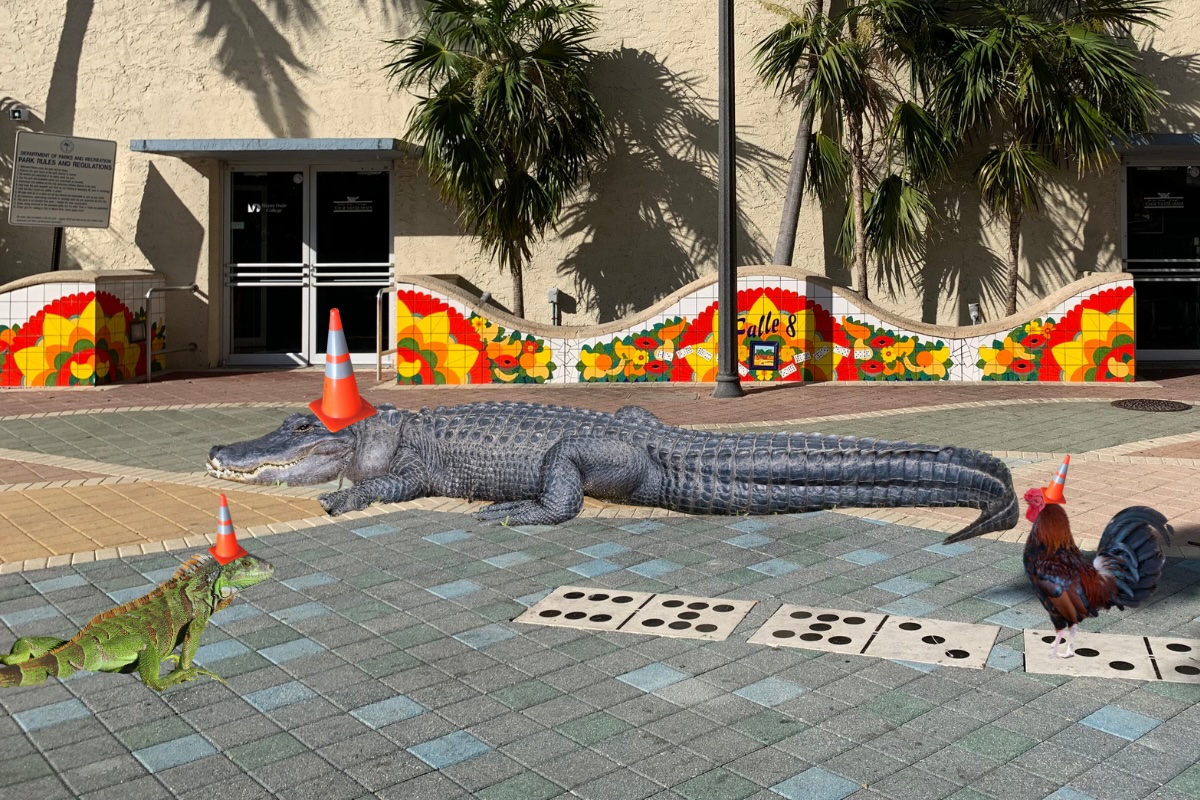 photoshopped image showing an iguana, alligator, and rooster with traffic cones on their heads in front of a mosaic mural on Miami's Calle Ocho
