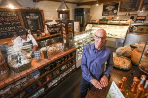 A man posing at a restaurant.