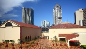 photo of a two-building museum with skyscrapers behind it
