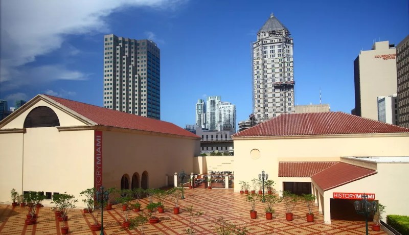 photo of a two-building museum with skyscrapers behind it