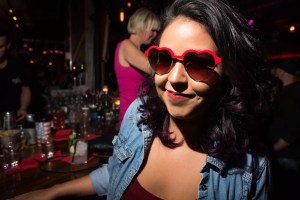 Woman wearing heart-shaped sunglasses