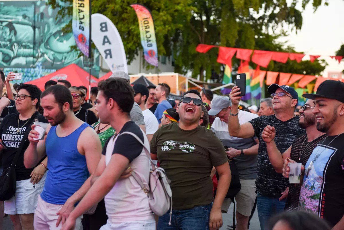 a group of men at a gay pride festival