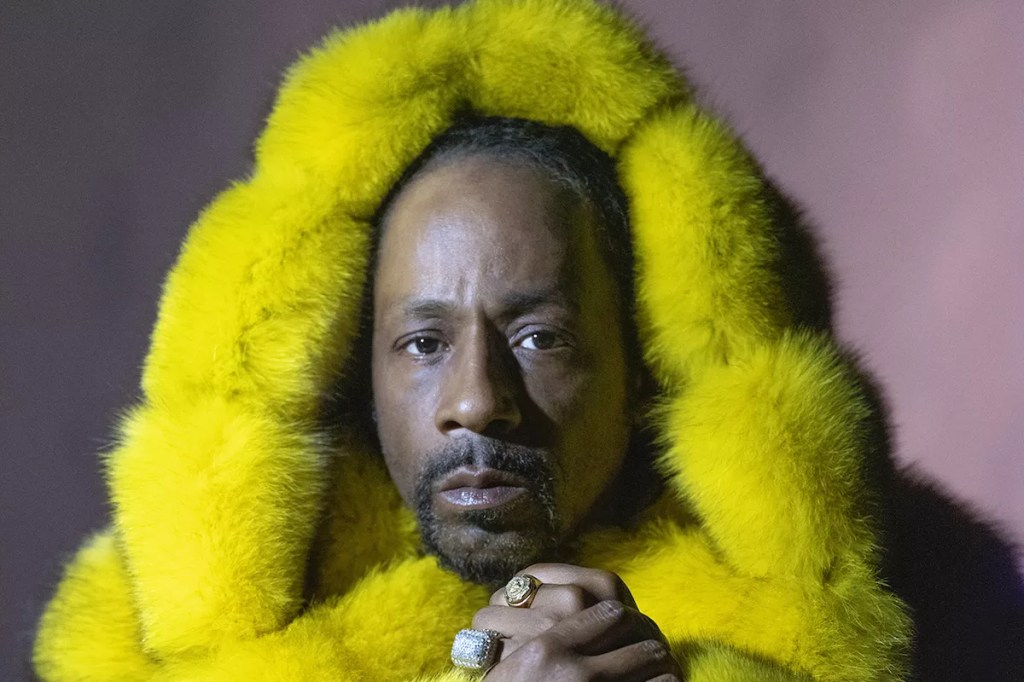headshot of comedian Katt Williams wearing a fuzzy, yellow hoodie