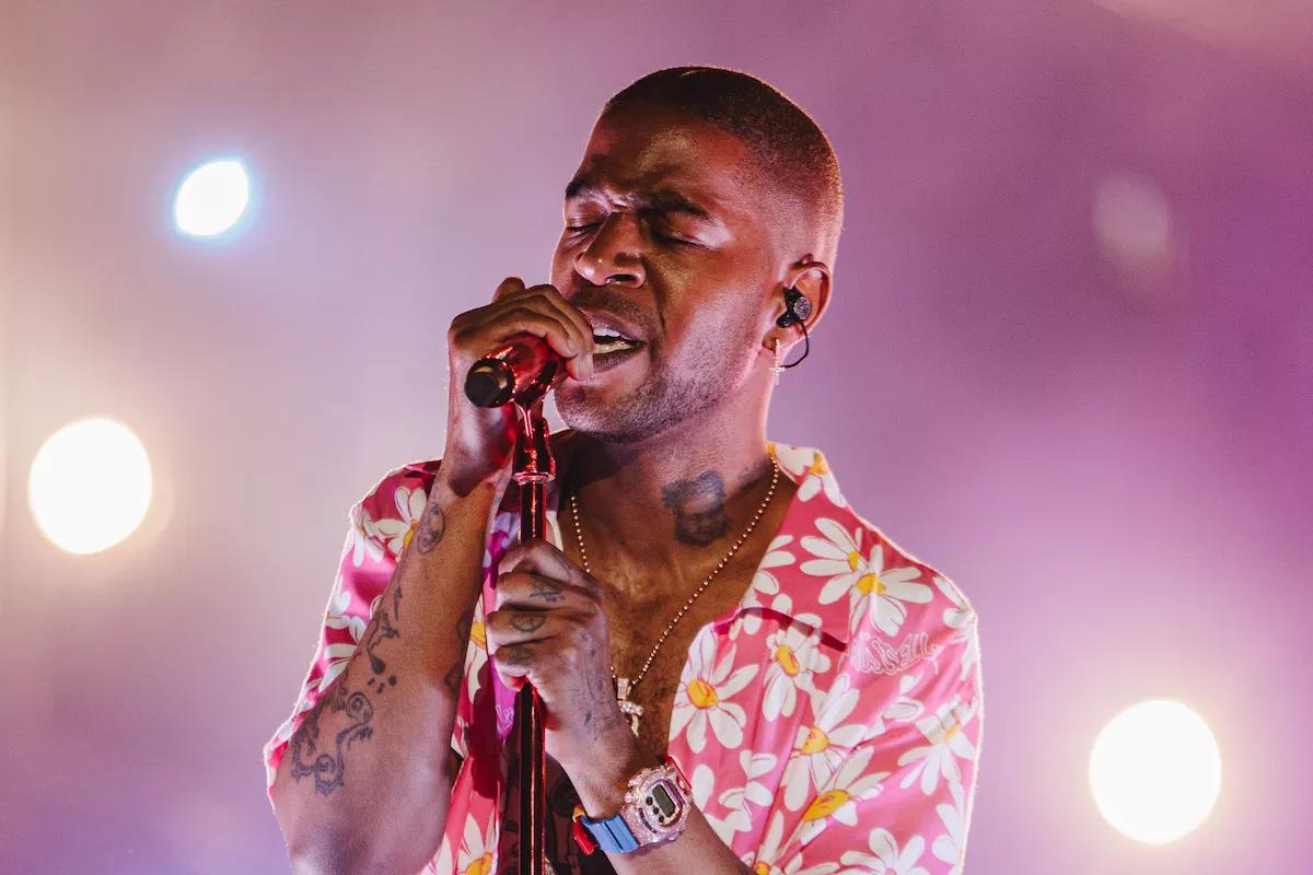 Photo of a man holding a microphone