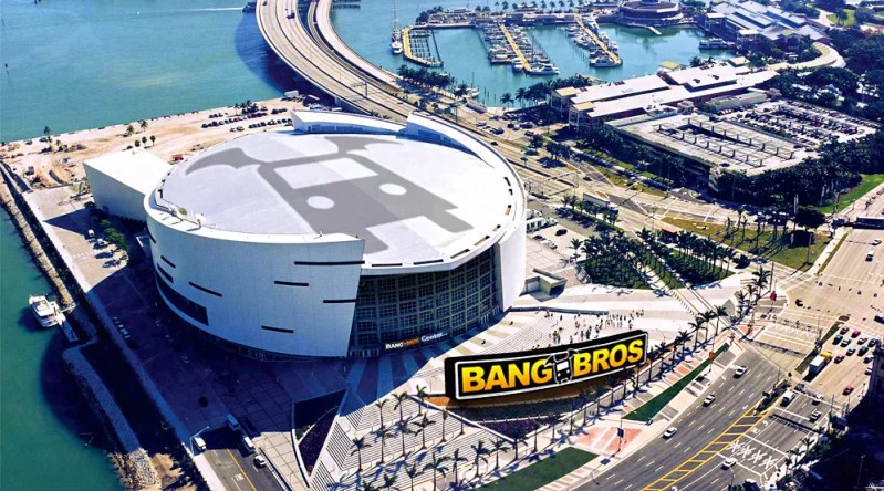 Aerial view of the home of the Miami Heat altered to show the logo of porn production company BangBros on the roof and signage. The venue was originally known as American Airlines Arena (1999 to early 2021) and later as FTX Arena (June 2021 to November 11, 2022), when the cryptocurrency exchange FTX.