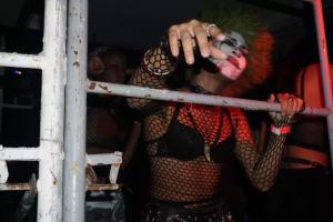 A woman in clown makeup dancing