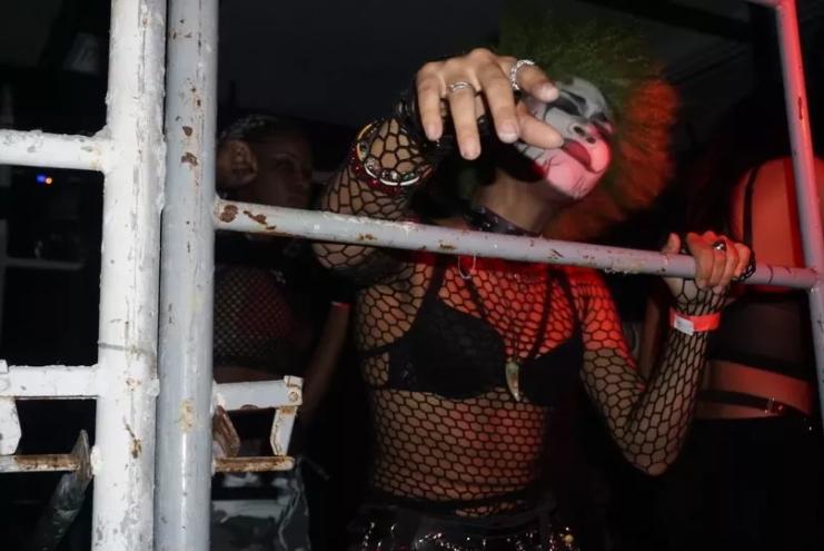 Picture of a goth woman dancing.