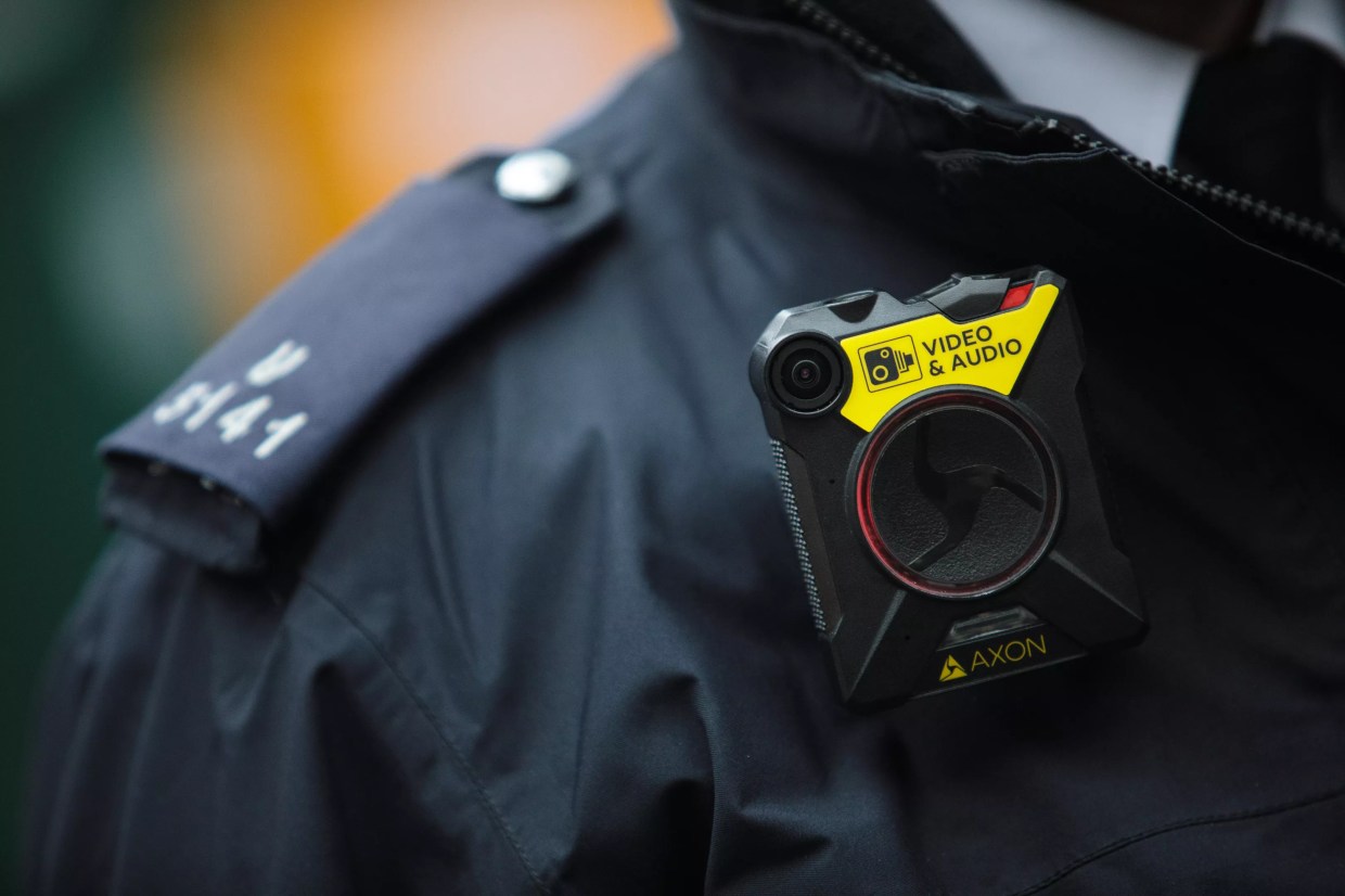 Image of a police officer's shirt and body-worn camera.