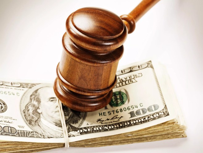 Gavel on top of a stack of money