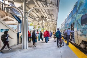 Riders get on and off Tri-Rail train