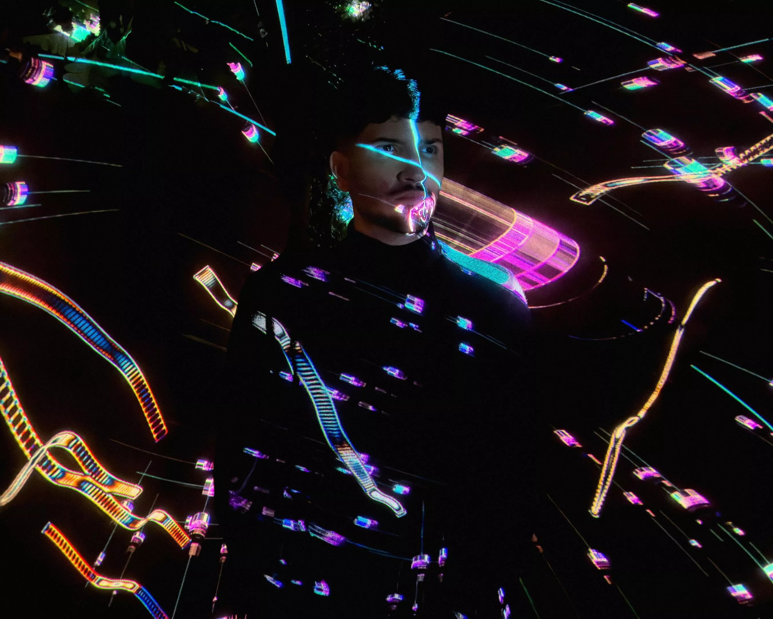 Producer Danny Daze with laser lights shining over his body