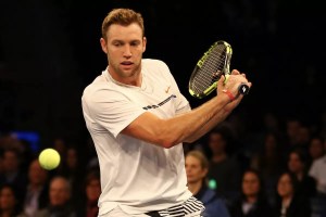 Jack Sock holding a pickleball racquet