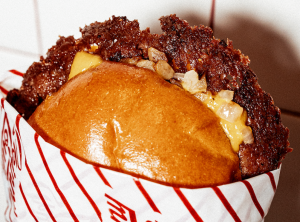 A smash burger with onions