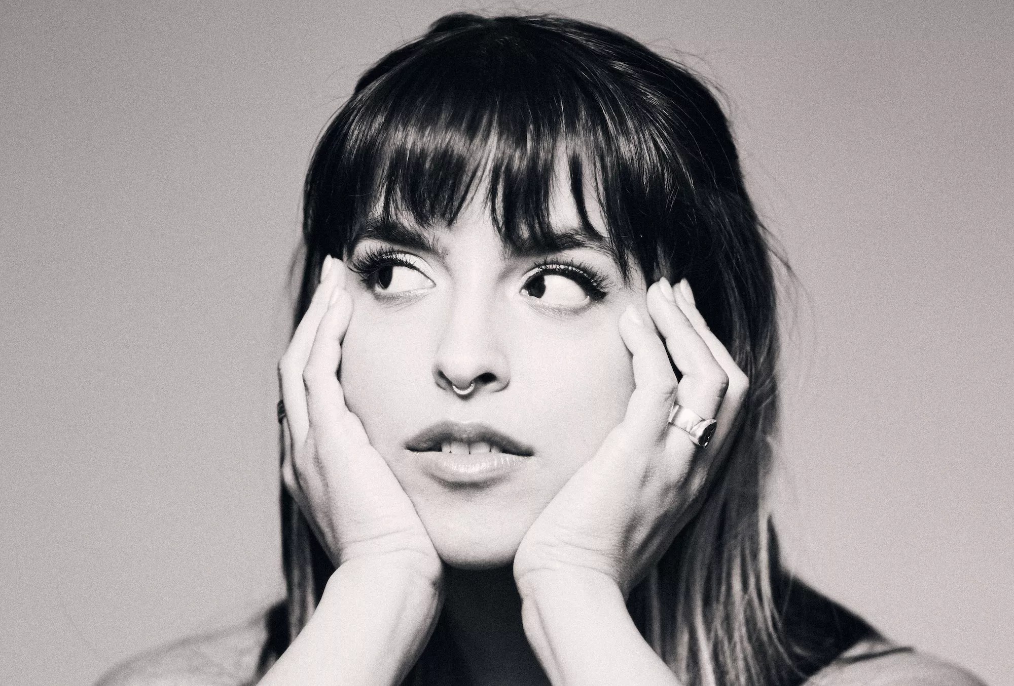 Black and white image of Gale with her hands under her chin