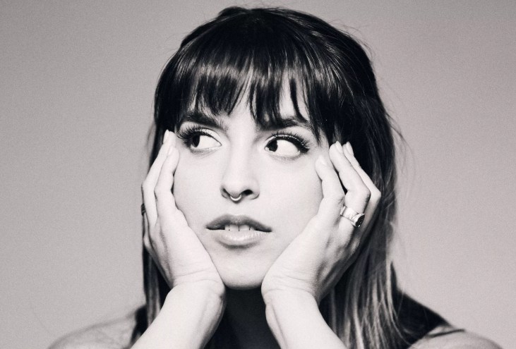 Black and white image of Gale with her hands under her chin