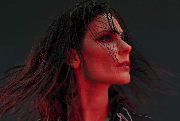 Portrait of Rebekha as she flips her hair