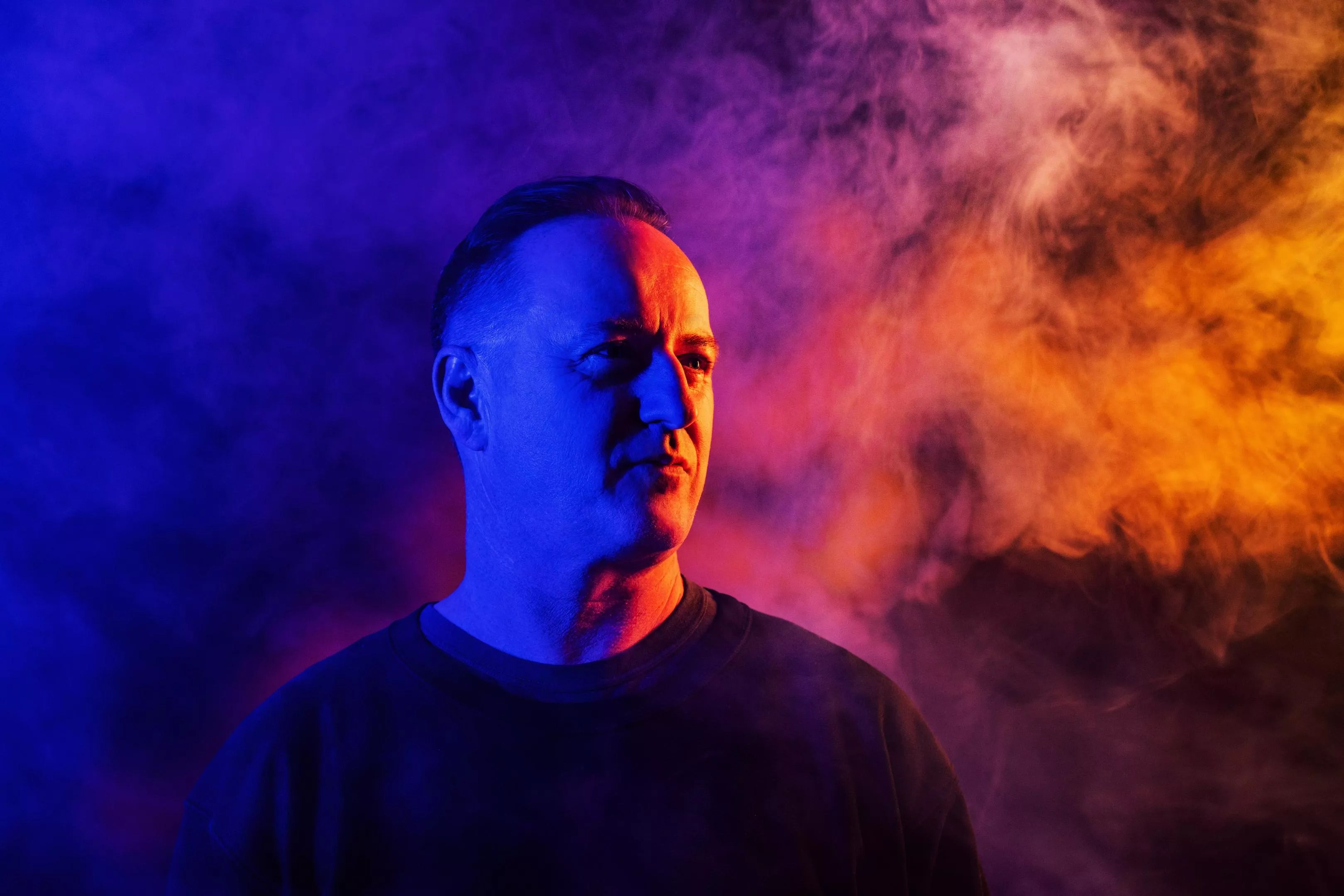 Sasha covered in blue and red light