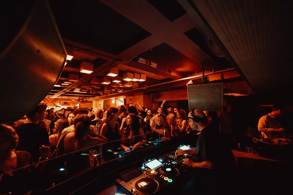 Photo of a room full of people dancing in Miami. 