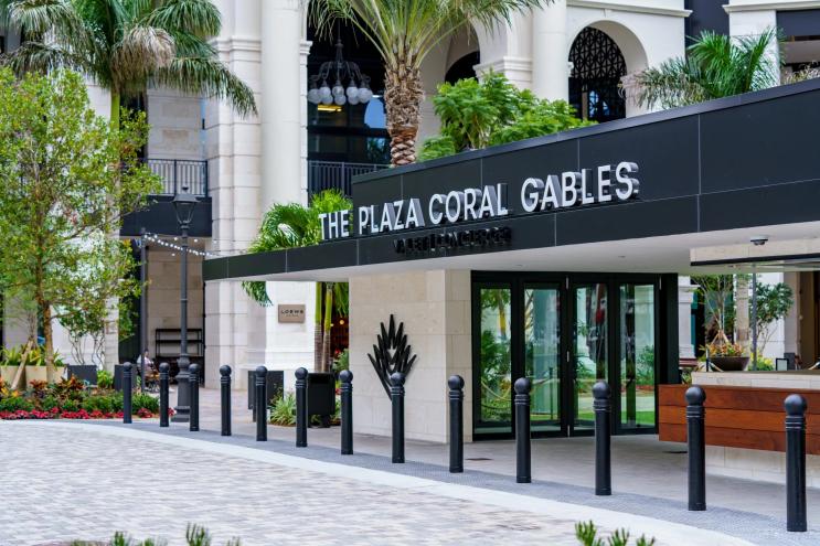 A sleek front lobby entrance to a luxury development in South Florida