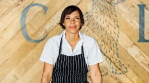 A chef with an apron posing