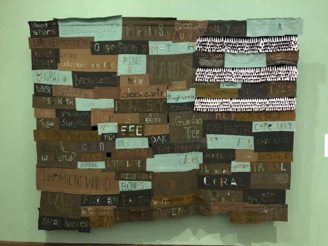 Word etched and painted on wooden boards