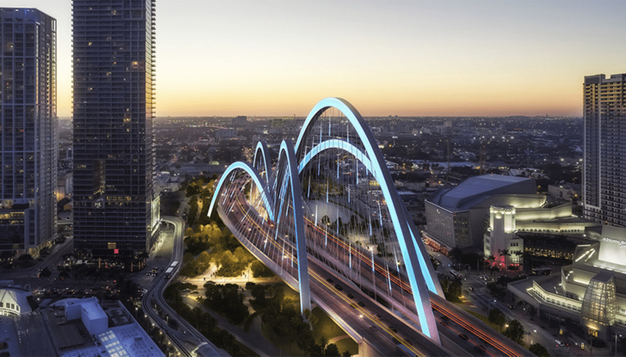 Conceptual image of towering arches over a downtown Miami highway, part of the Signature Bridge project