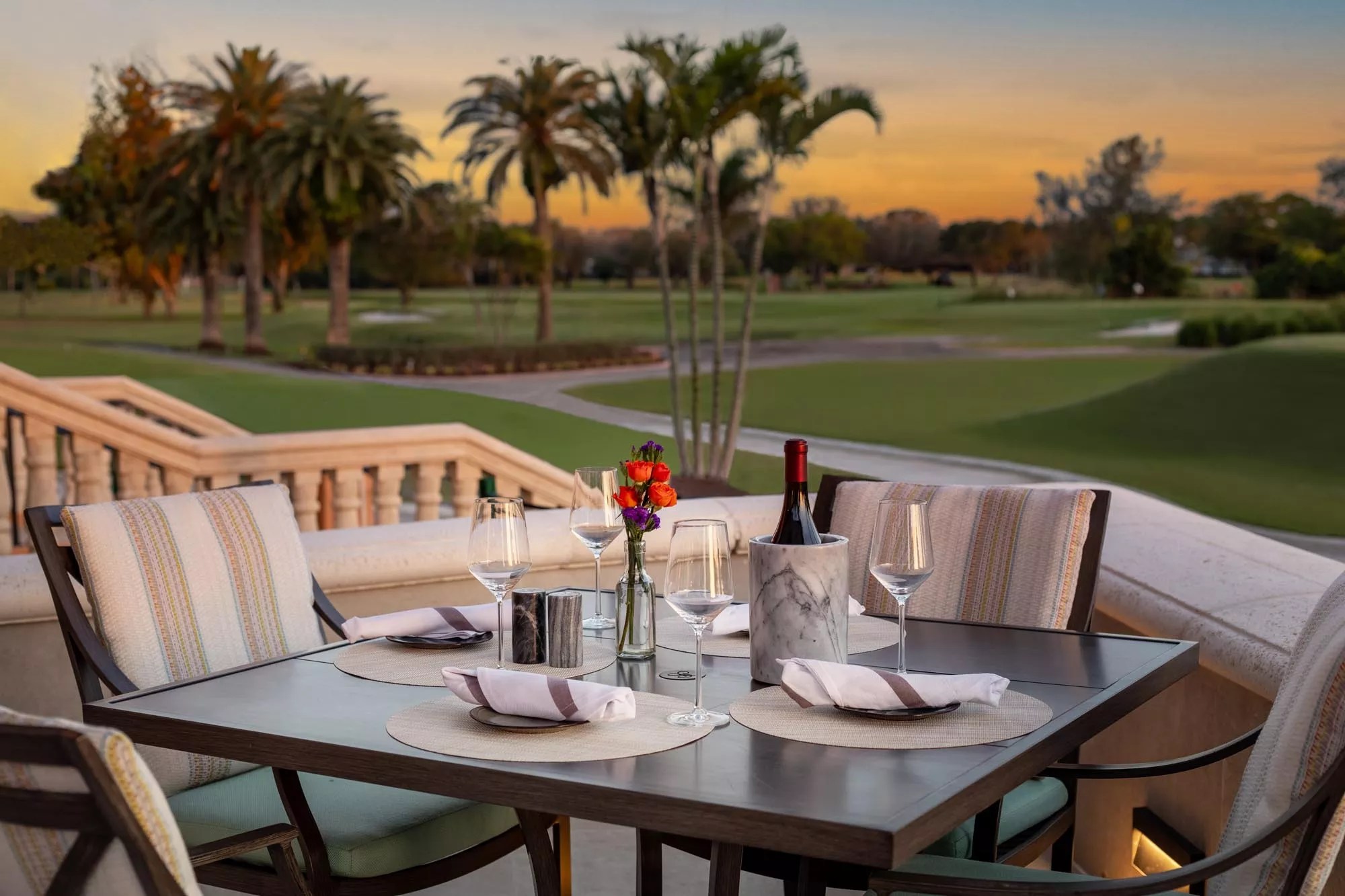 Dining table outdoors overlooking golf course
