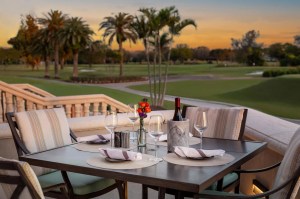 Dining table outdoors overlooking golf course