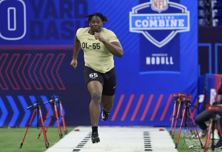Offensive tackle Patrick Paul darts in a timed sprint at the NFL combine