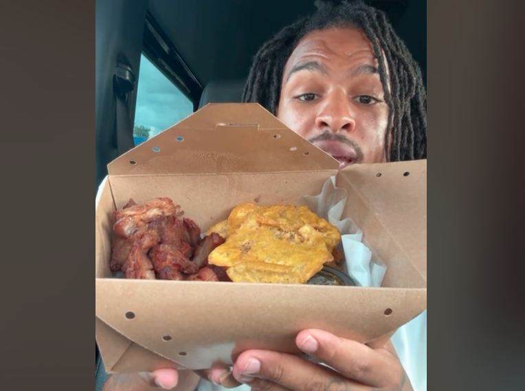 Keith Lee eating out of cardboard box