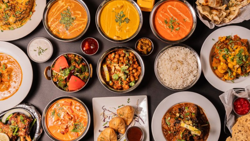 Multiple Indian dishes in different bowls.