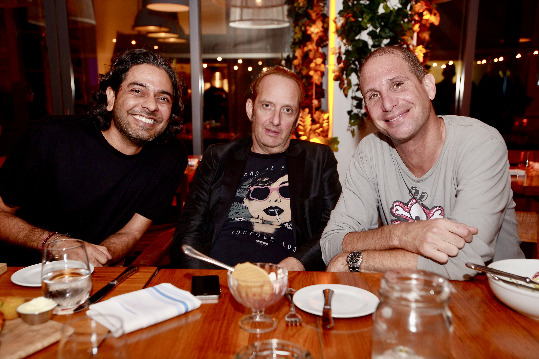 Three men posing for a photo