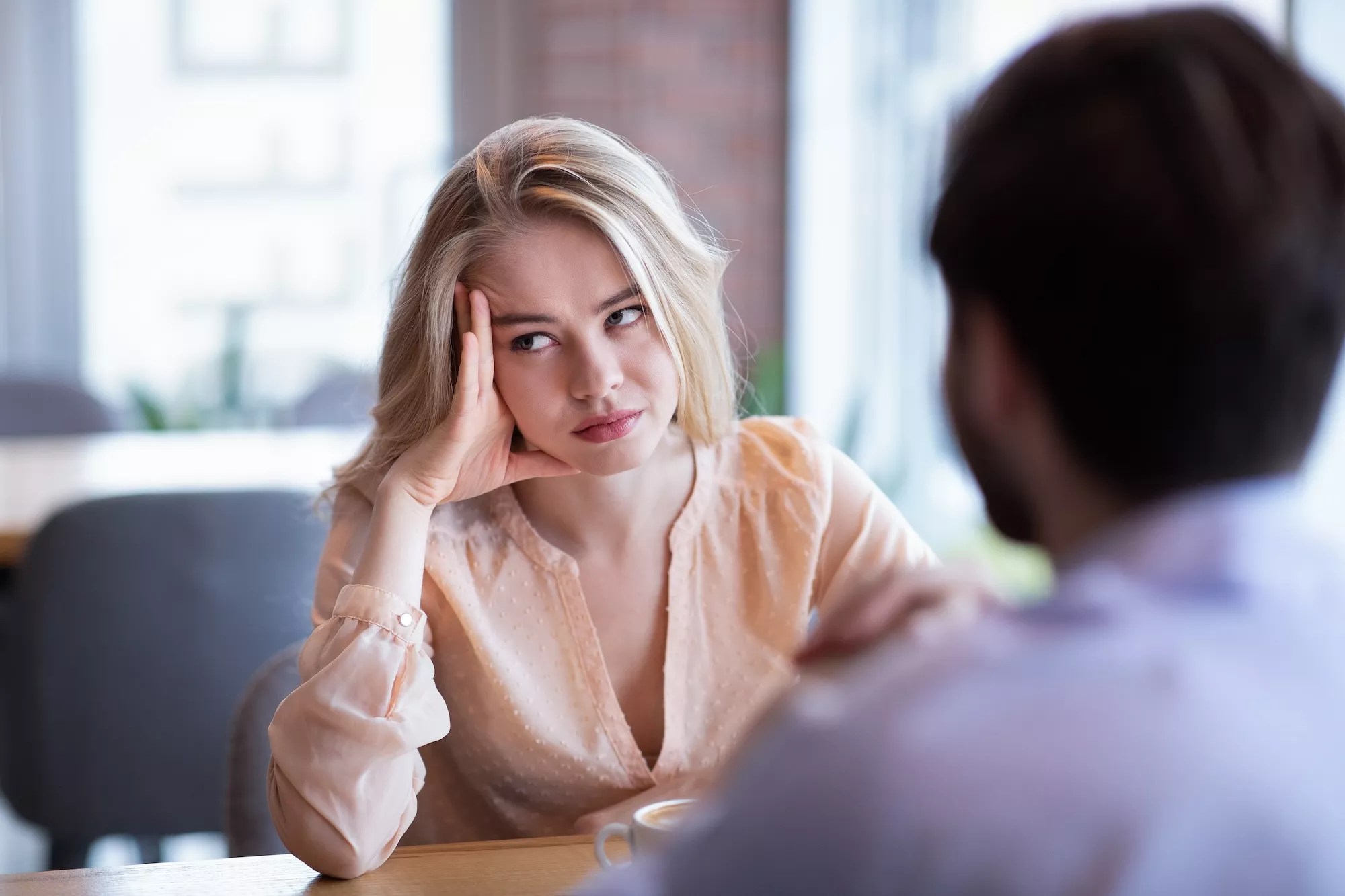 Woman bored at a restaurant