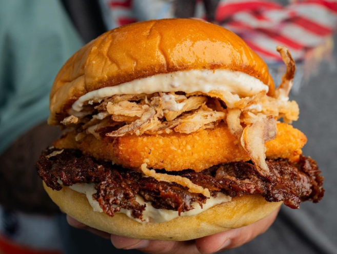 a burger with toppings