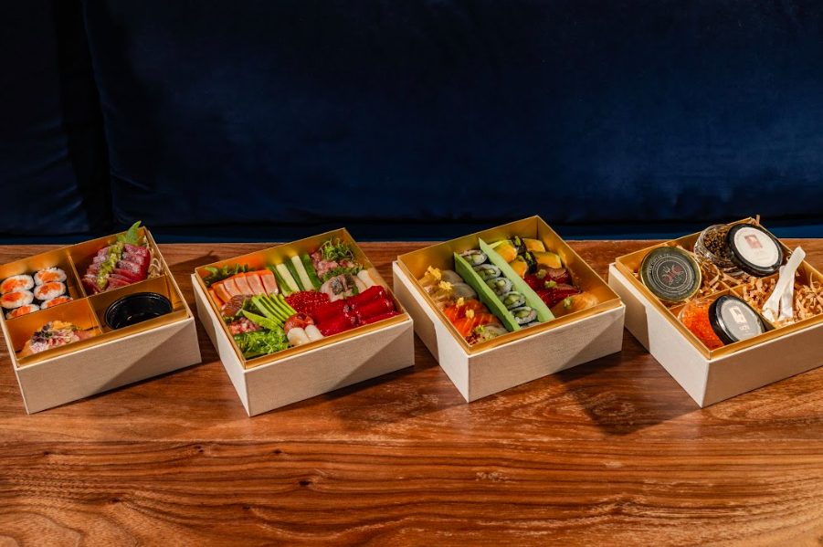sushi boxes on wood table