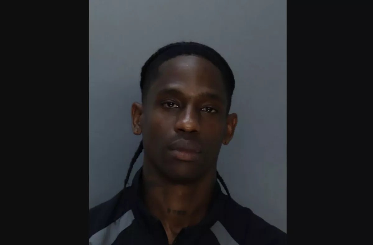 Front-facing mug shot of rapper Travis Scott.