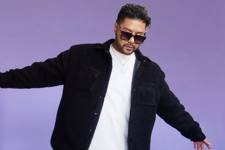 Portrait of Wax Motif against a purple background