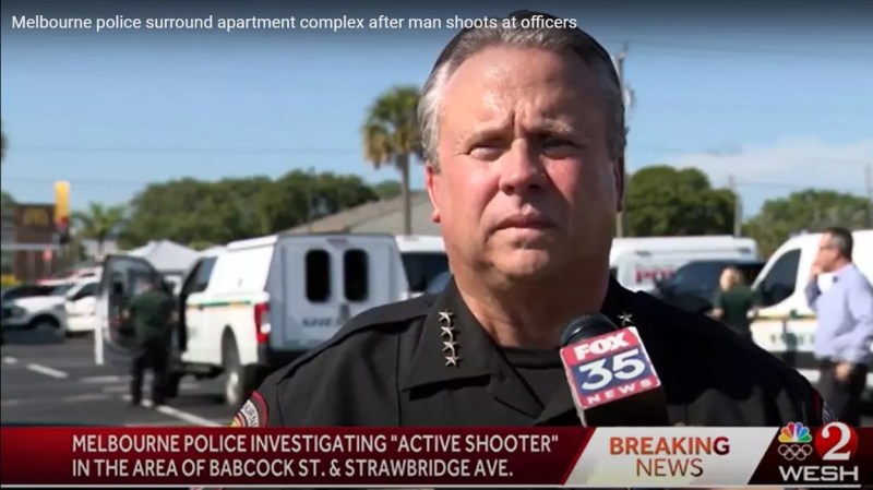 Closeup of Melbourne Police Chief's face as he stands in front of reporters in an active-shooter briefing
