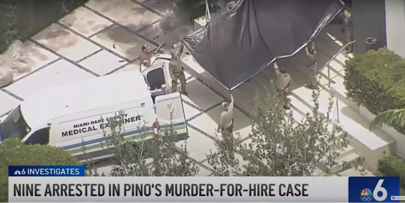 Medical examiner's truck pulls up at Sergio Pino's home after he was found dead during an FBI raid