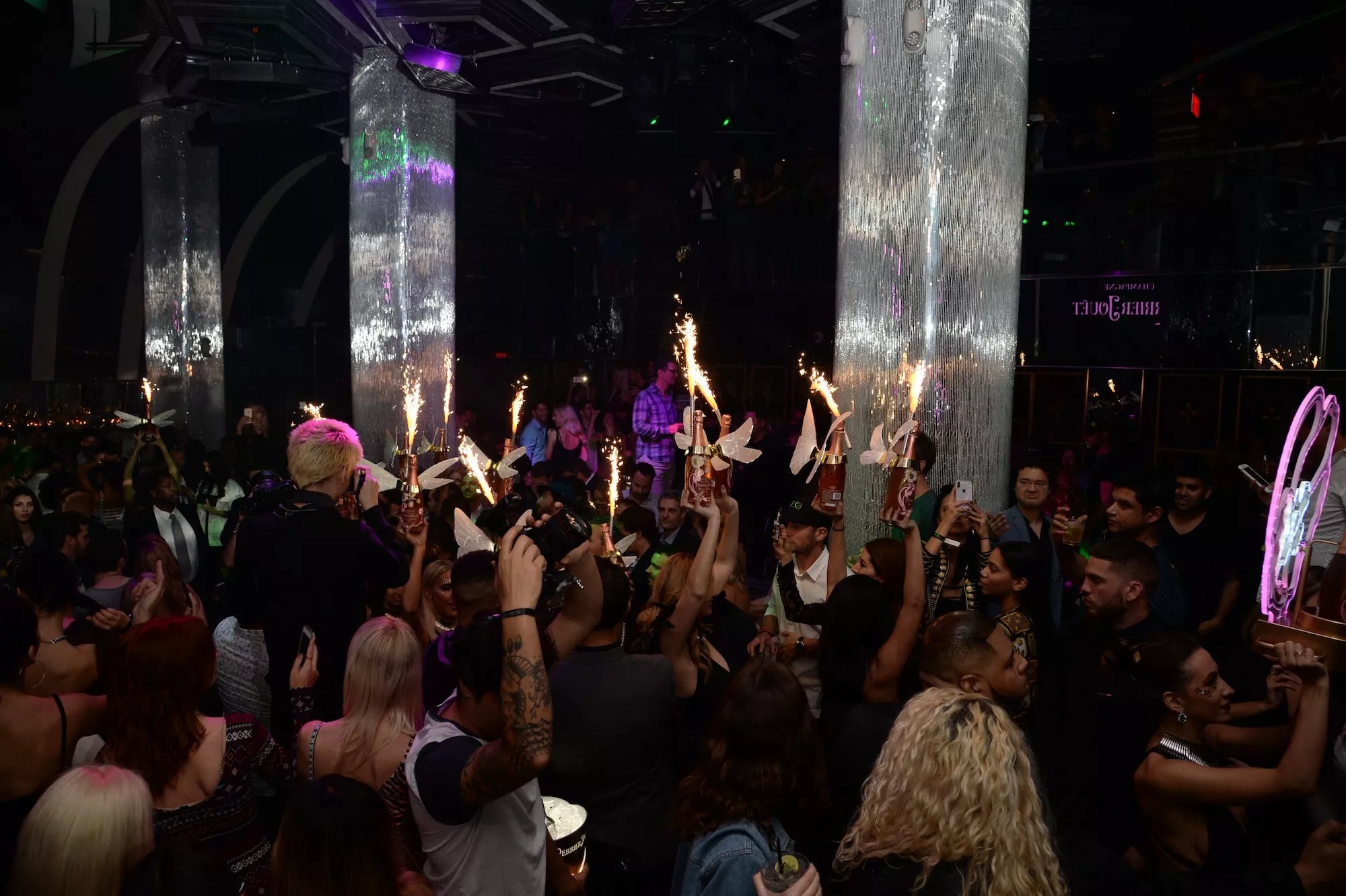People partying inside a nightclub at Miami Beach