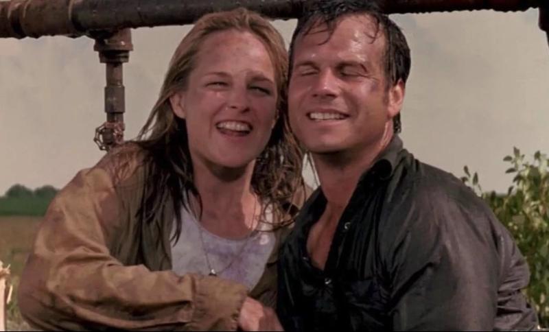 The storm-drenched costars of Twister looking ecstatic at having survived and also very much in love
