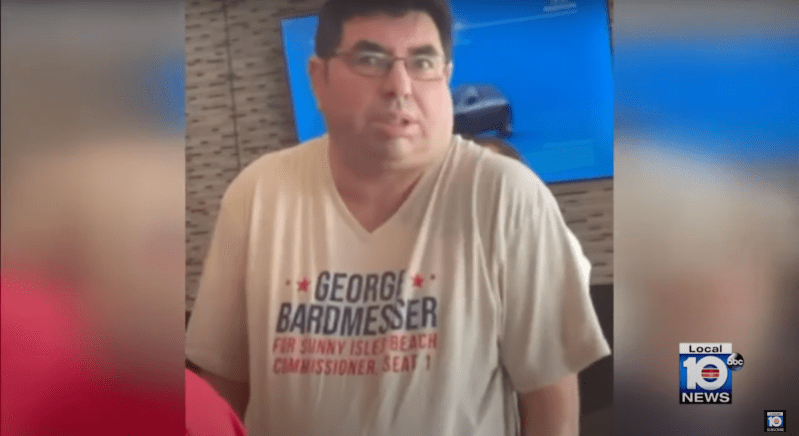 A startled George Bardmesser, wearing a shirt that says, "George Bardmesser."