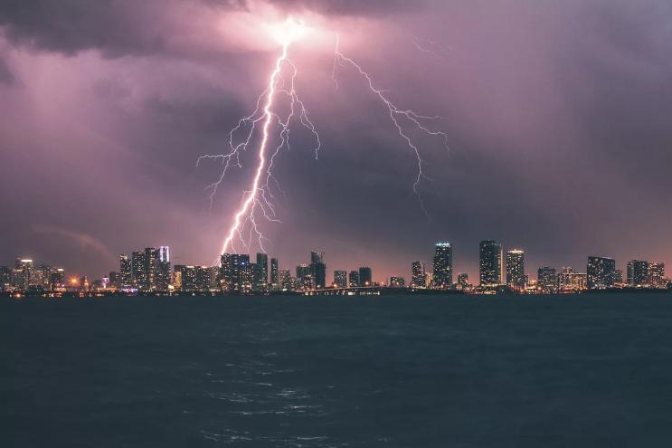 A stunning lightning strike illuminates the Miami skyline at night