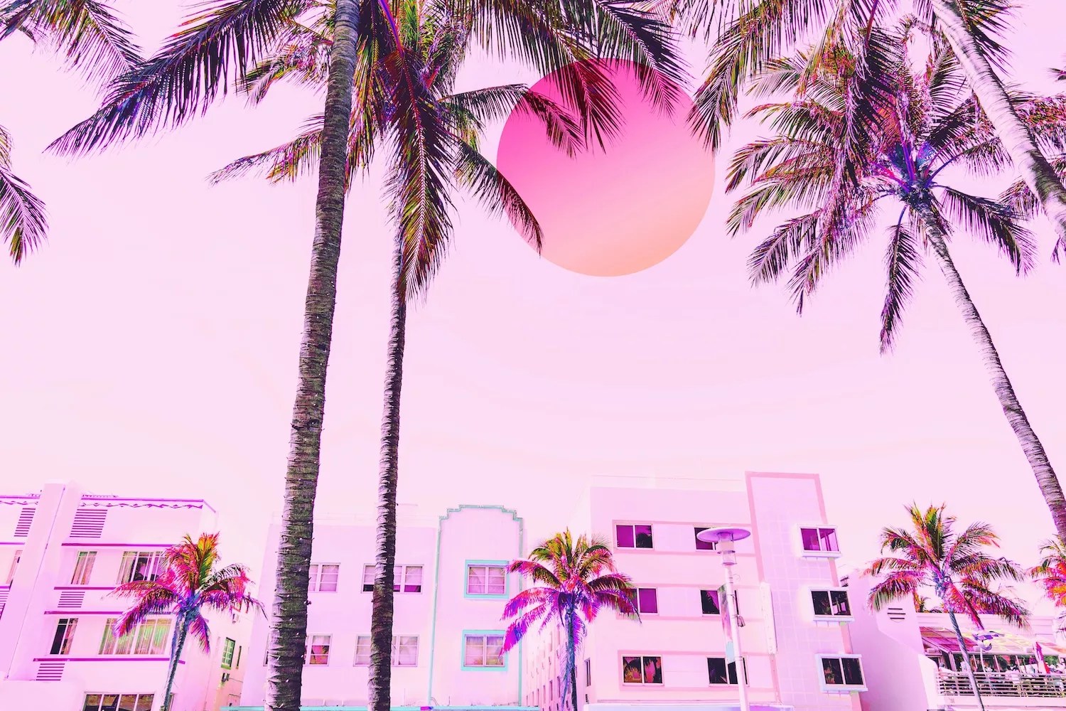 Dreamy picture of Miami Beach Ocean Drive hotelscape with neon colors and big sun