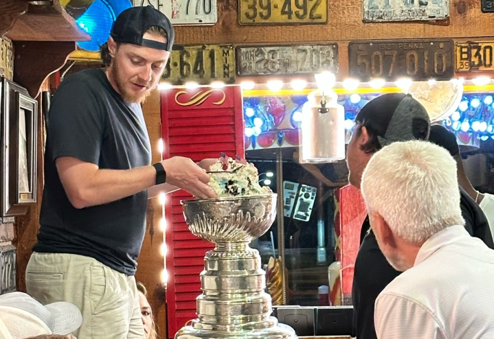man holding trophy
