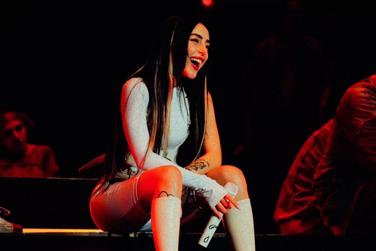 Nicki Nicole performing on stage