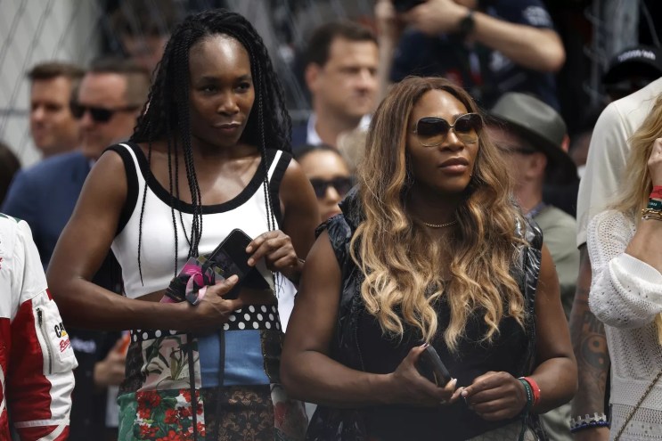 Venus Williams and Serena Williams watch the grid presentation prior to the F1 Grand Prix of Miami at Miami International Autodrome on May 07, 2023 in Miami, Florida