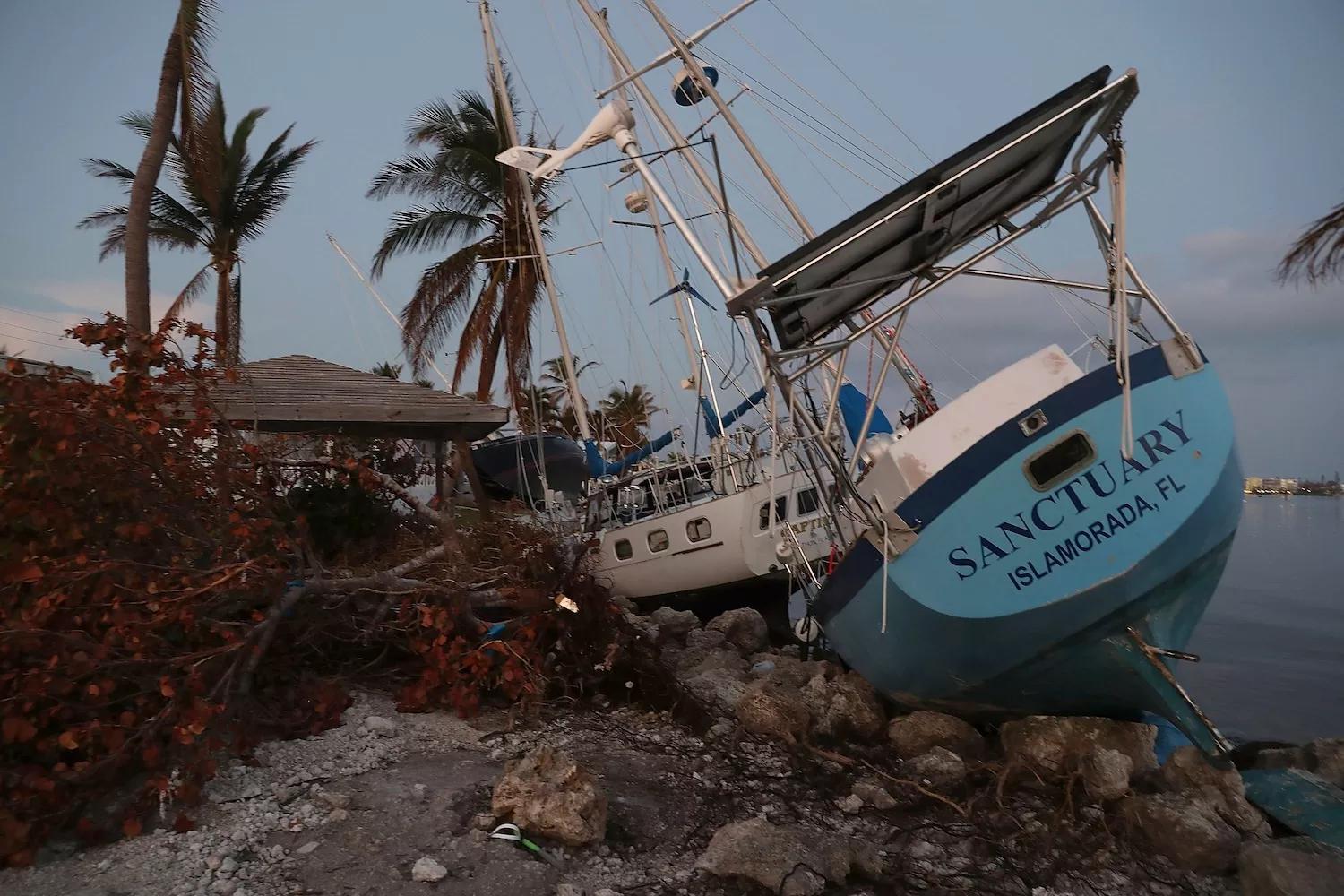 MARATHON, FL - SEPTEMBER 19, 2017: Boats are pushed up along the shoreline after Hurricane Irma passed through Marathon, Florida. The Federal Emergency Management Agency reported that 25 percent of all homes in the Florida Keys were destroyed and 65 percent sustained major damage when they took a direct hit from Irma.