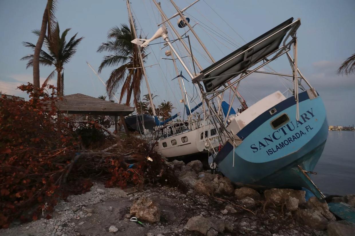 MARATHON, FL - SEPTEMBER 19, 2017: Boats are pushed up along the shoreline after Hurricane Irma passed through Marathon, Florida. The Federal Emergency Management Agency reported that 25 percent of all homes in the Florida Keys were destroyed and 65 percent sustained major damage when they took a direct hit from Irma.